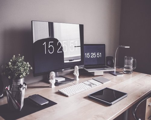 Ergonomic home office station setup with adjustable display and standard light
